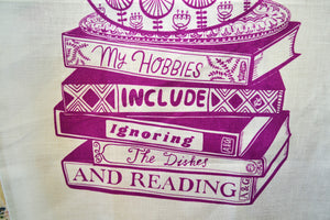 Able and Game white tea towel with print which reads 'my hobbies include ignoring the dished and reading'